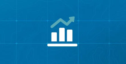 Bar chart with upward arrow on blue background, symbolizing financial growth or investment.