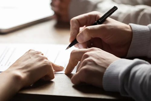 People signing documents